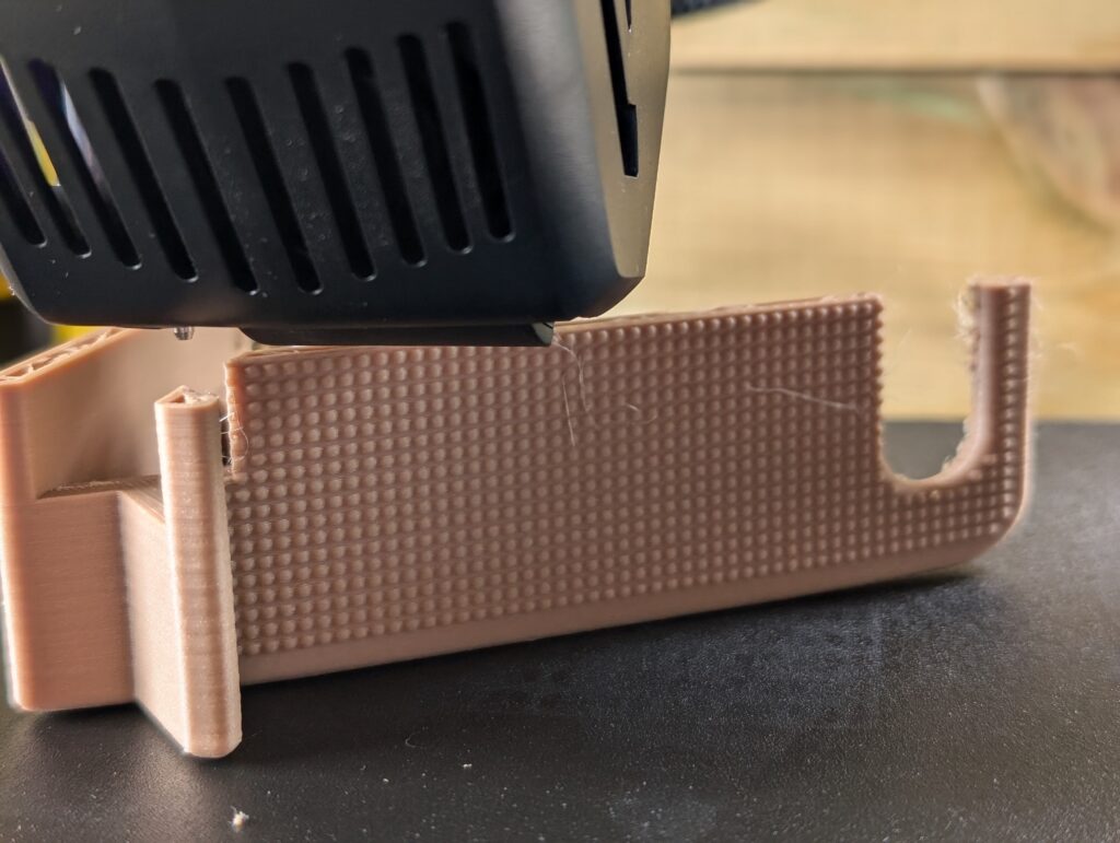 3D Printer creating a Phone Stand