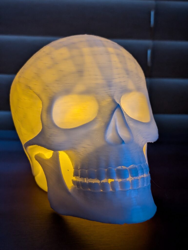 3D printed Skull lamp lit up